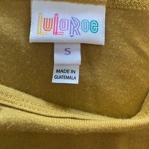 Shirt mid in front long in back.